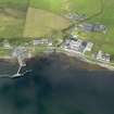 Oblique aerial view of Bruichladdich distillery and pier, taken from the ESE.