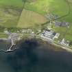 Oblique aerial view of Bruichladdich distillery and pier, taken from the ESE.