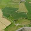 Oblique aerial view centred on the cropmarks of the settlement, taken from the NNE.