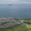 General oblique aerial view of the town with Ailsa Craig and Kintyre in the distance, taken from the E.