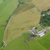 Oblique aerial view of Macharioch farm centred on the cropmarks of the pits, taken from the WNW.