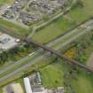 Oblique aerial view centred on the railway viaduct, taken from the NW.