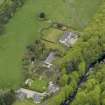 Oblique aerial view centred on the Lodge with Octagon Cottage adjacent, taken from the SE.