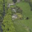 Oblique aerial view centred on the Lodge with Octagon Cottage adjacent, taken from the NNW.