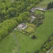 Oblique aerial view centred on the Lodge with Octagon Cottage adjacent, taken from the NNW.