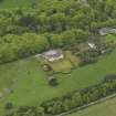 Oblique aerial view centred on the Lodge with Octagon Cottage adjacent, taken from the NW.