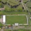 Oblique aerial view centred on the football ground, taken from the SW.