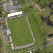 Oblique aerial view centred on the football ground, taken from the SE.