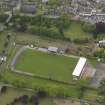 Oblique aerial view centred on the football ground, taken from the NE.