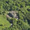 Oblique aerial view centred on the remains of the country house, taken from the NNW.