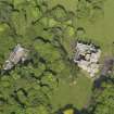Oblique aerial view centred on the house with the terraced garden adjacent, taken from the W.