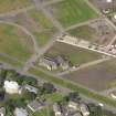 Oblique aerial view centred on Richmond Craigmillar Church, taken from the SE.