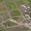 Oblique aerial view centred on site of former Niddrie Mains estate, taken from the E.