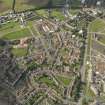 General oblique aerial view centred on Niddrie Mains Road and Niddrie Marischal estate, taken from the ESE.