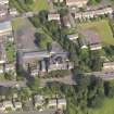 Oblique aerial view centred on Niddrie Marischal primary school, taken from the S.