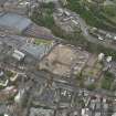 Oblique aerial view centred on the site of redevlopment with the Council Offices adjacent, taken from the SE.