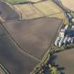 Oblique aerial view of the soilmarks of the fort with the Pentcaitland maltings adjacent, taken from the ESE.