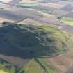 Oblique aerial view of the remains of Traprain Law fort, taken from the WNW.