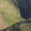 Oblique aerial view of the remains of terraces on the flank of Traprain Law fort, taken from the E.