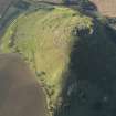 Oblique aerial view of the remains of the fort and settlement on North Berwick Law, taken from the ENE.