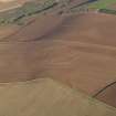 General oblique aerial view of the soilmarks of the fort of The Chesters, Spott, taken from the SW.