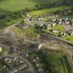 Oblique aerial view centred on the demolition of the distillery, taken from the NNW.
