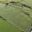 Oblique aerial view centred on the cropmarks of the pit-alignment and unenclosed settlement, taken from the N.