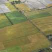 Oblique aerial view centred on the cropmarks of the rig near East Haven, taken from the SE.