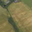 Oblique aerial view centred on the cropmarks of the rig and ring ditch with Hatton Country House adjacent, taken from the SSE.