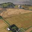 Oblique aerial view of the cropmarks of the round houses and ring ditches of the unenclosed settlement at Newbigging, taken from the N.