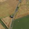 Oblique aerial view centred on the cropmarks of the Roman Temporary Camp, ring ditches, round houses and rig and furrow at Dun, taken from the W.