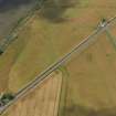 Oblique aerial view of the cropmarks of the rectilinear enclosure at Tayock, taken from the ENE.