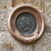 Detail of circular plaque on E wall. William Bell Scott LLD HRS.  Poet Artist