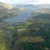 General oblique aerial view centred on the village with Loch Tay adjacent, taken from the SW.