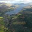 General oblique aerial view centred on the village with Loch Tay beyond, taken from the SW.
