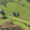 Oblique aerial view centred on the remains of St Fillans chapel, taken from the NE.