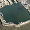 Oblique aerial view centred on the main basin of Rosyth Dockyard, taken from the SW.