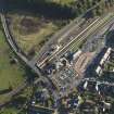 Oblique aerial view centred on the railway station, taken from the NNW.