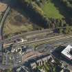 Oblique aerial view centred on the railway station, taken from the NW.