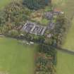 Oblique aerial view centred on the farmstead with the sawmill adjacent, taken from the WNW