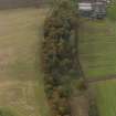 Oblique aerial view centred on the remains of the roman fort, taken from the ESE.