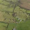 Oblique aerial view centred on the remains of a dispersed domestic site, taken from the WSW.