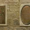 Interior. W end. Memorial plaques. Detail