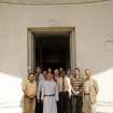 UK team, church officers and architect, Manish Chakroborti (front left) with Father Andrew outside main entrance