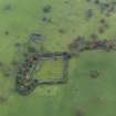 Oblique aerial view centred on the walled garden with the remains of a farmstead adjacent, taken from the E.