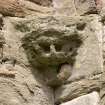 E end of chapter-house, detail of corbel in NE corner