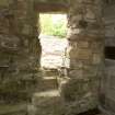 Interior. Sacristy/bakehouse, view of opening in W wall leading to bread oven