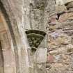 Detail of corbel and springers for vault ribs in NW corner of E end of chapter house.