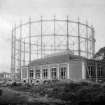 View of building and gasometer during construction of Granton Gas Works.

