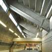 Interior view of fitness studio showing exposed concrete structure of stadium grandstand, Meadowbanks Sports Centre, Edinburgh.